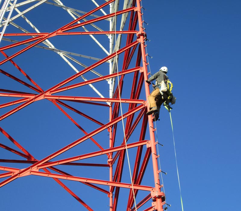 worker climbing tower